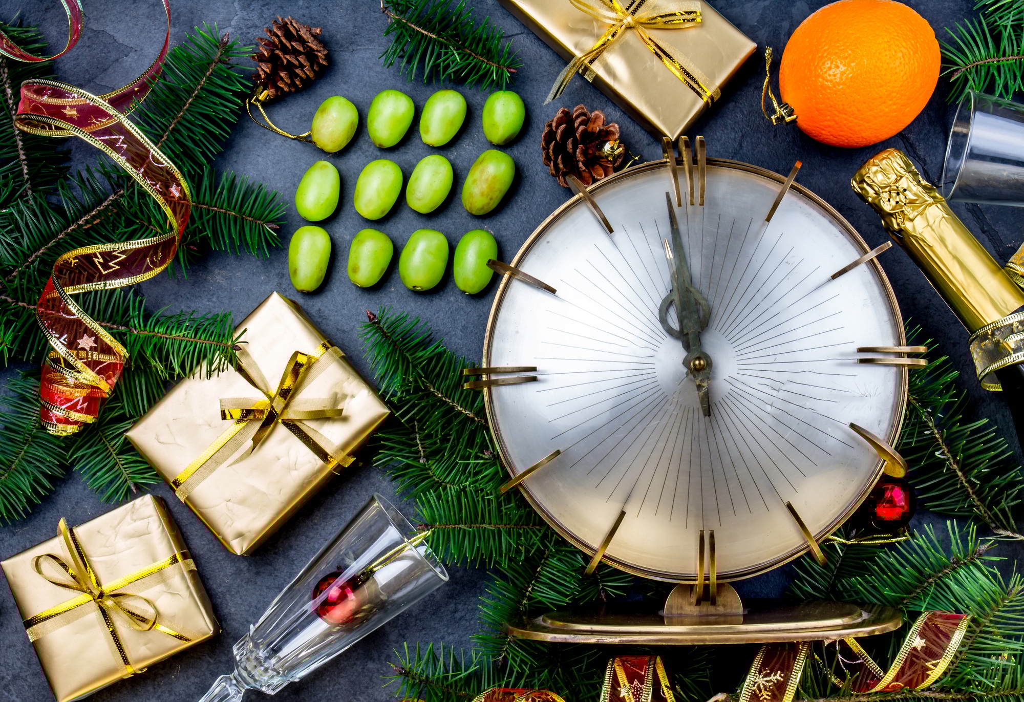 dsfdgSpanish New Year tradition funny ritual to eat twelve 12 grapes for good luck at midnigth.